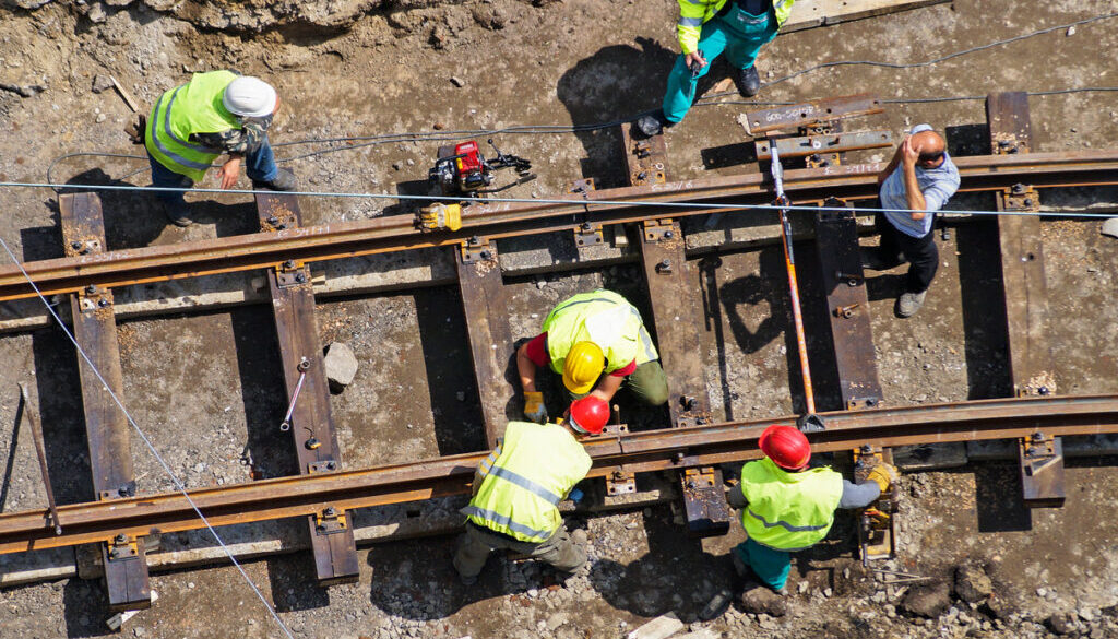 A group of men constructing a railway